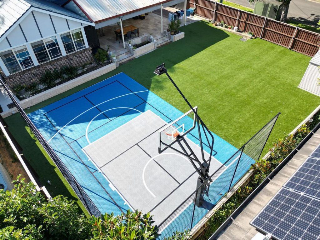A finished backyard multi-sport court built with Outdoor Sport Courts interlocking tiles